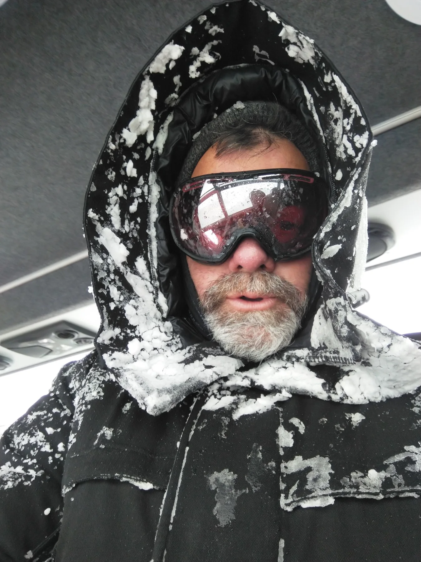 Joe Derrick covered in snow during filming