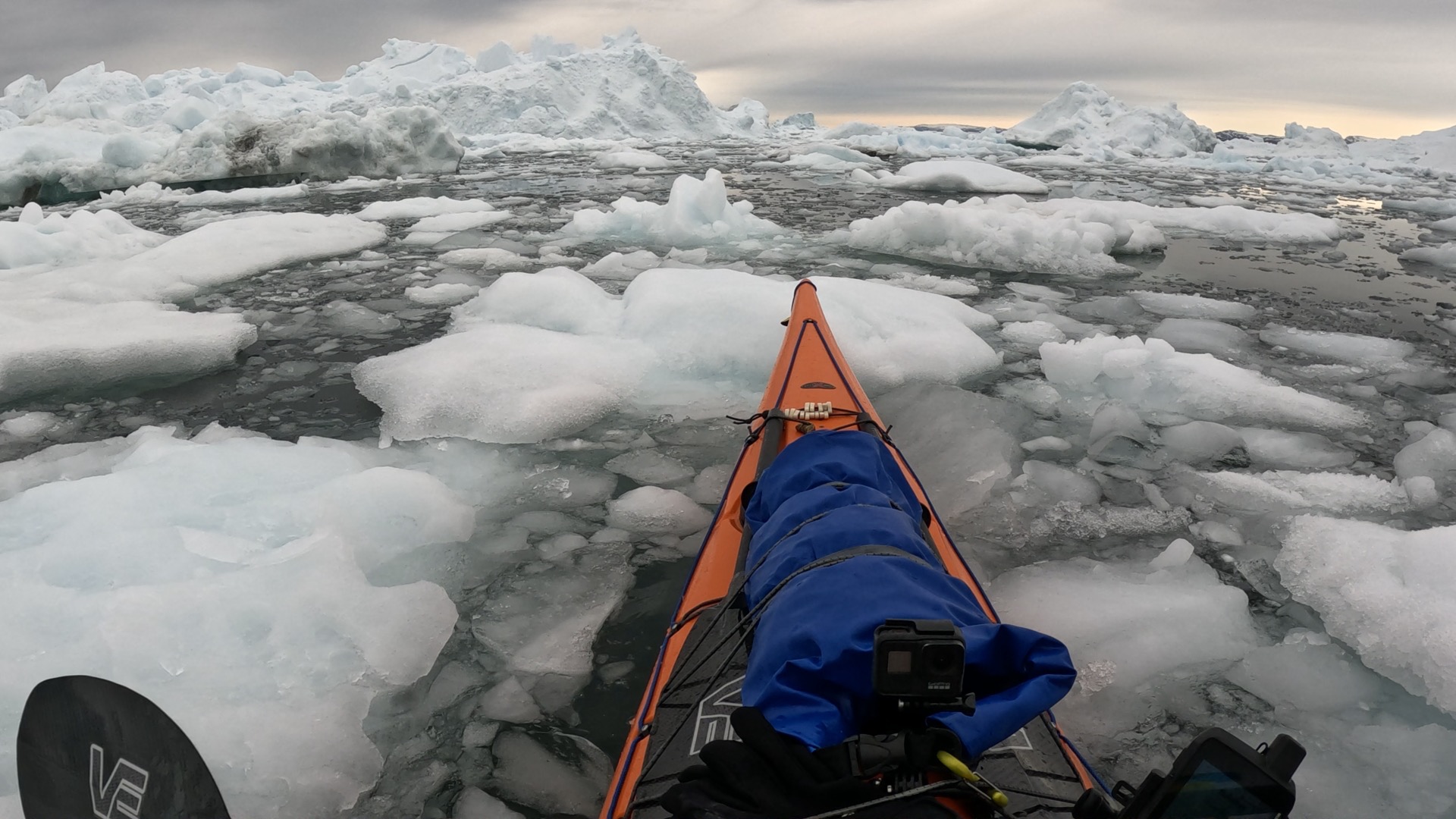 Kayak moving through Arctic sea ice