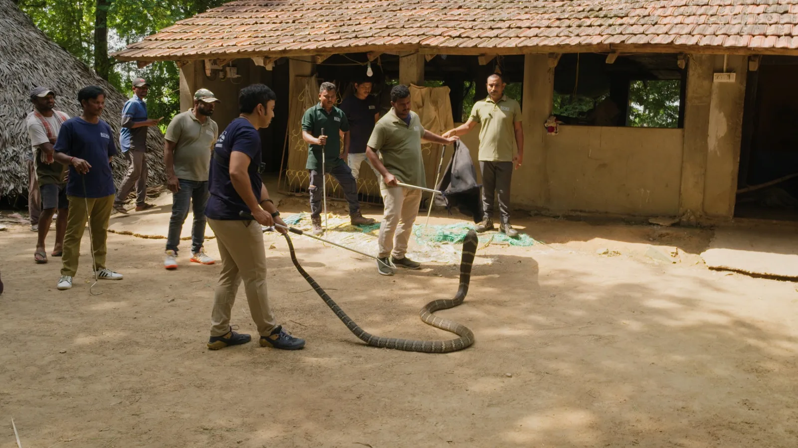 Snake handlers during filming in India